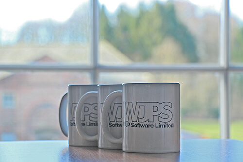 WJPS Mugs on table